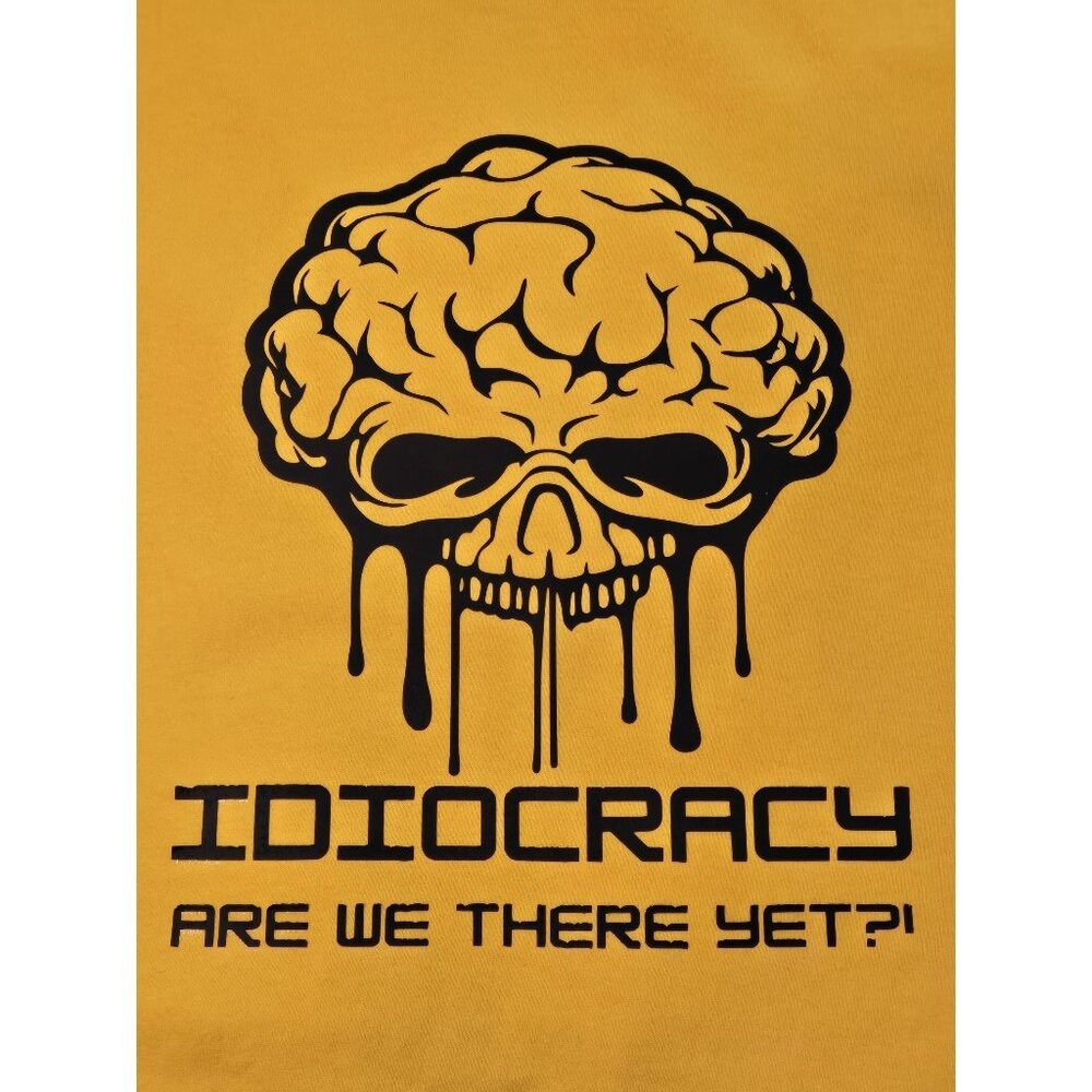 IDIOCRACY, are we there yet?! Bright yellow T-shirt. We're quickly getting there